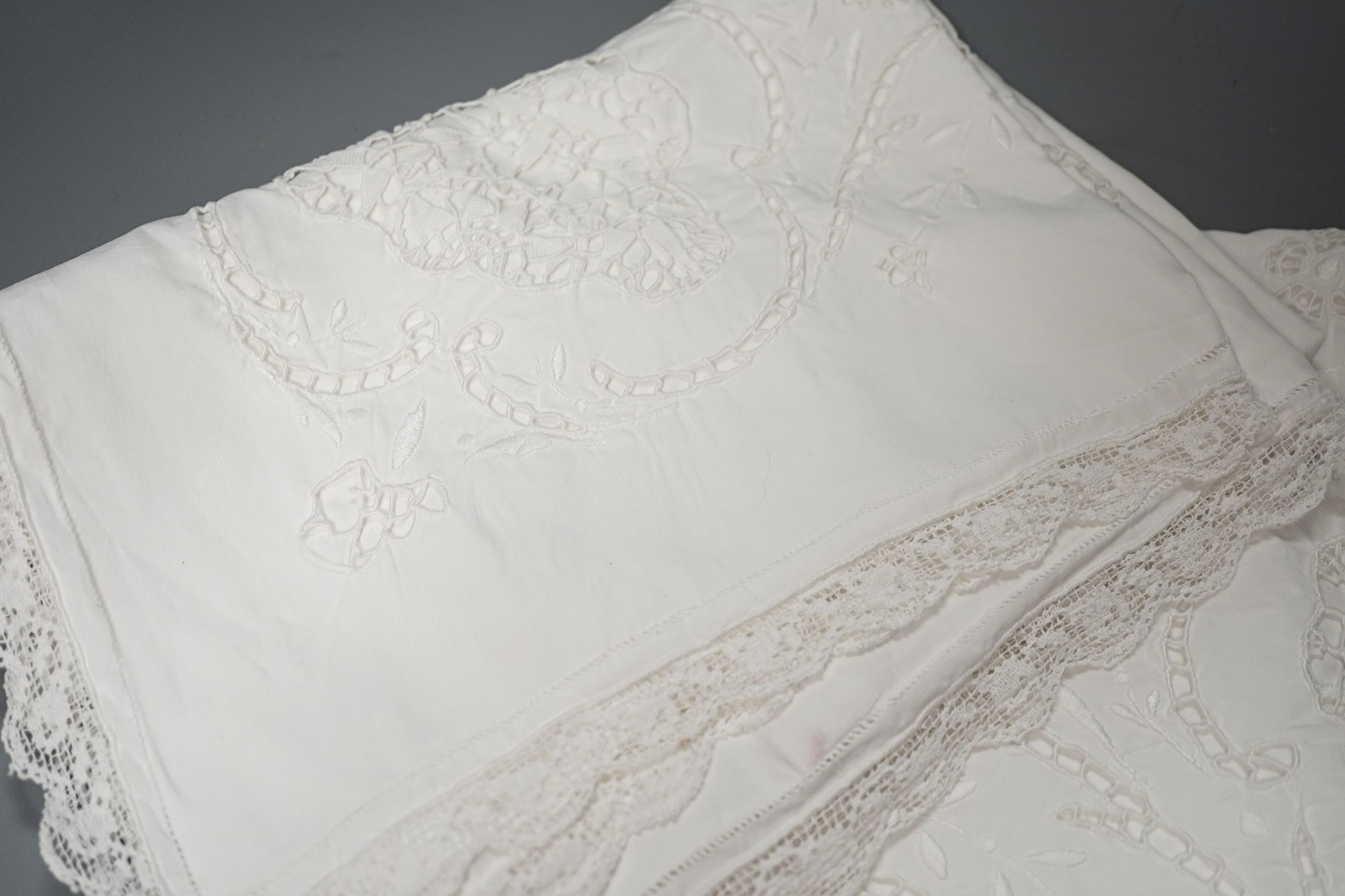 A pair of cutwork and filet pillow cases, two christening gowns, crochet cloth etc